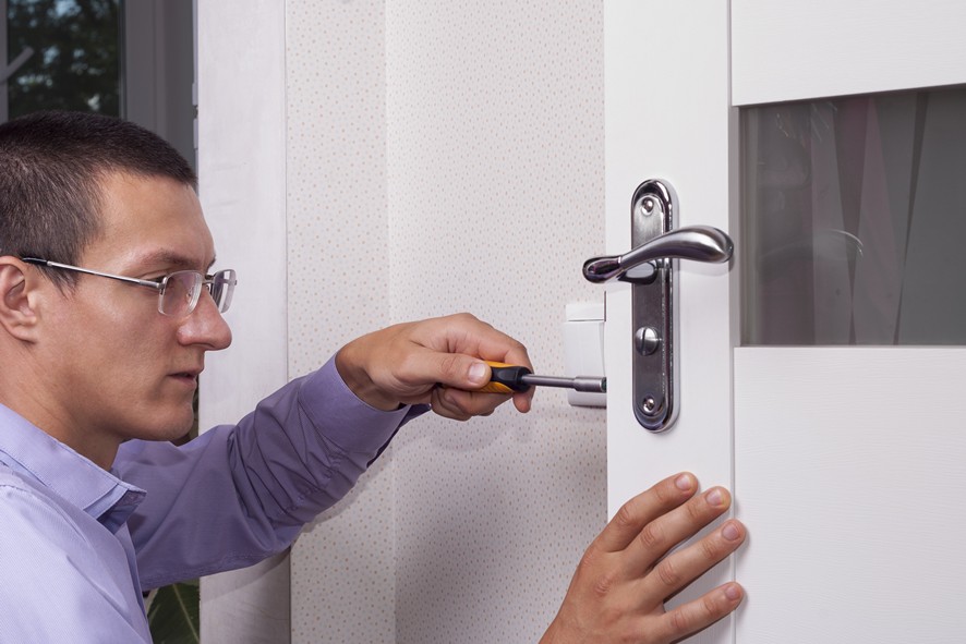 Houston locksmith demonstrating smart lock features to a custome